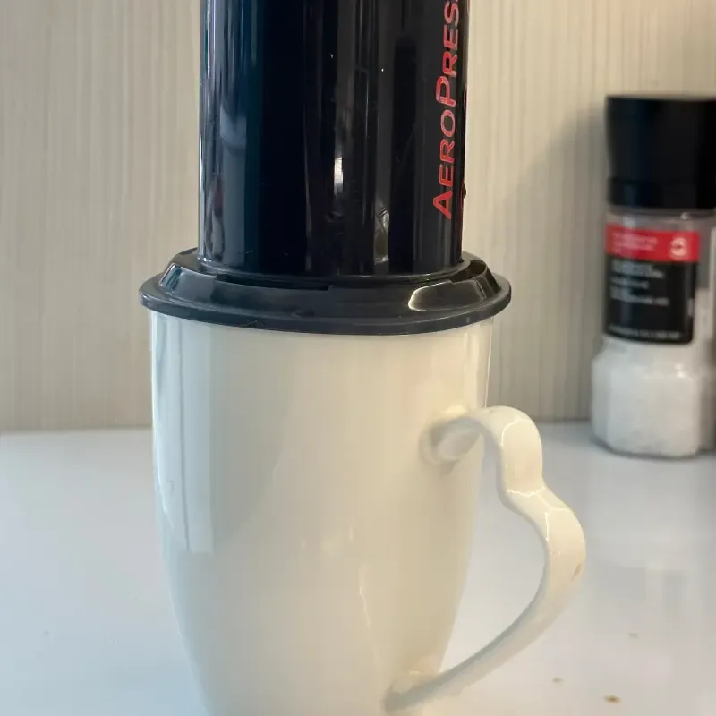 Aeropress after swirling on top of a coffee cup