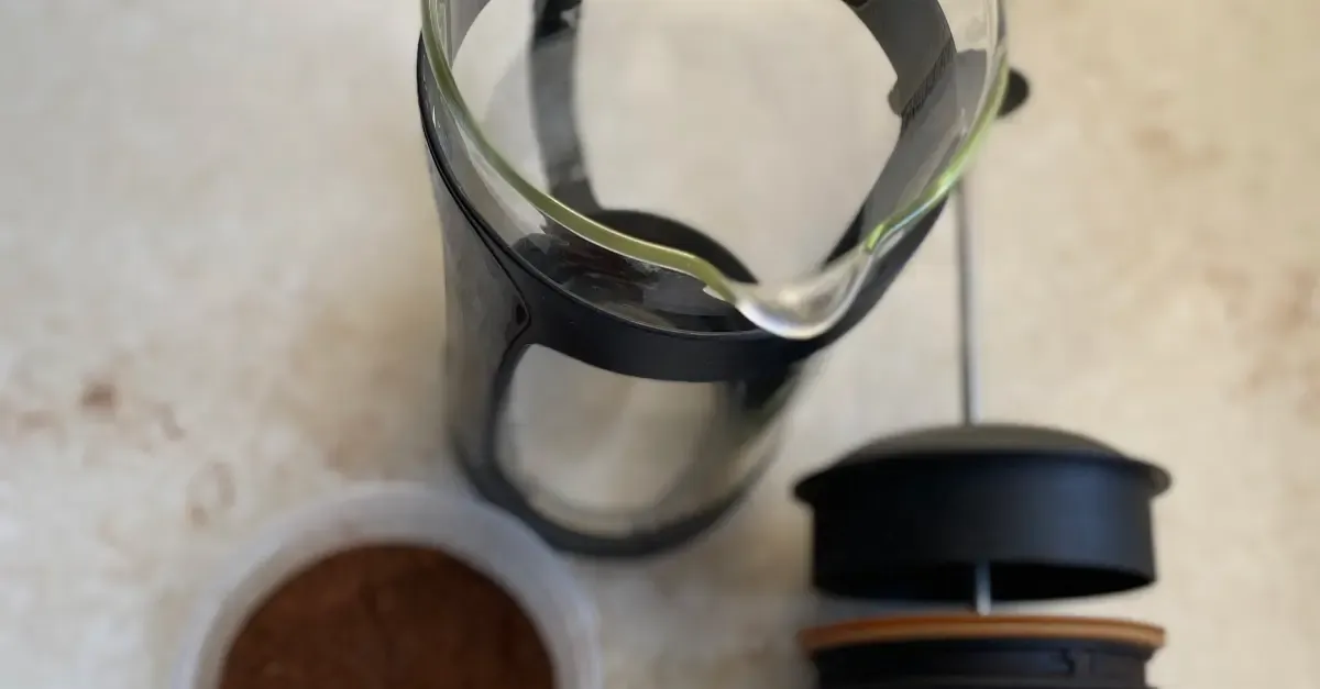 Espro french press and coffee grinds on a table