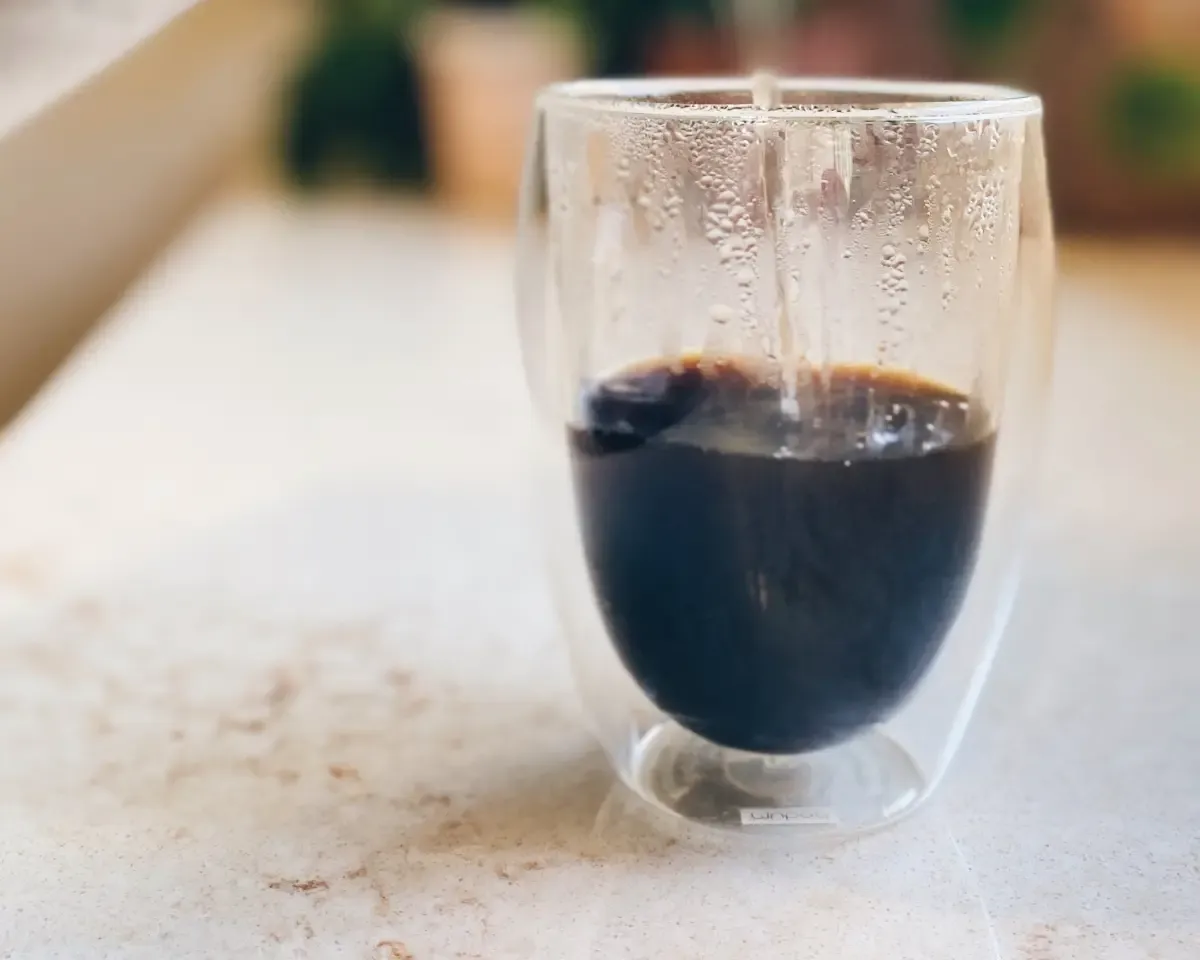 a budum cup with steamy coffee