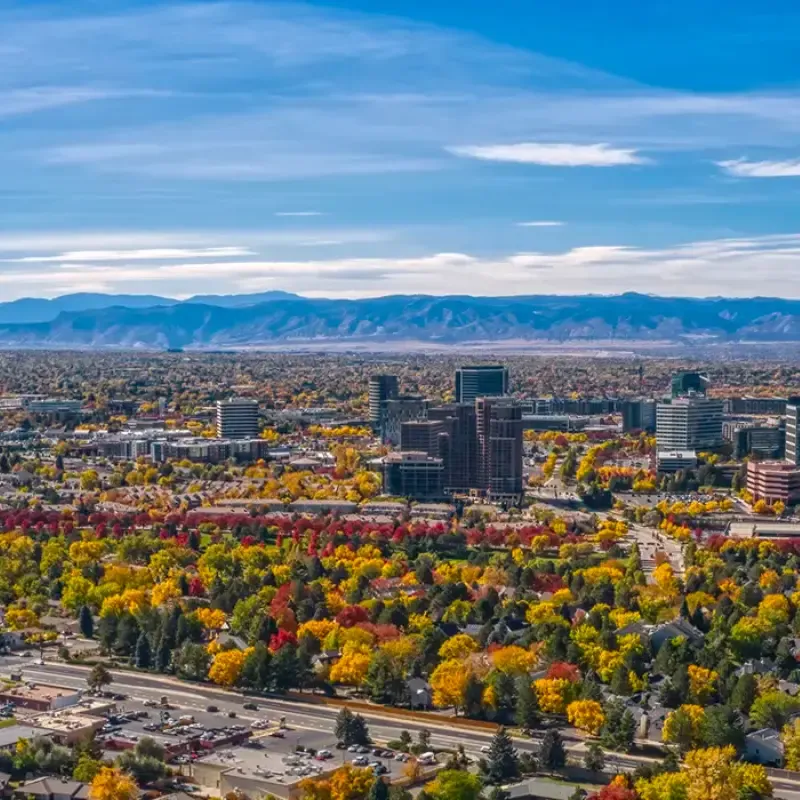 Airplane view of Aurora, Denver and the Mountains on the horizon