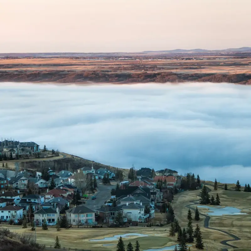 City of Cochrane under low clouds on a sunrise