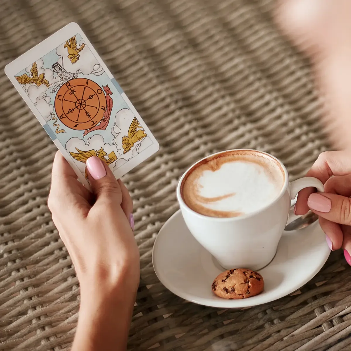Cup of coffee with a tarot card