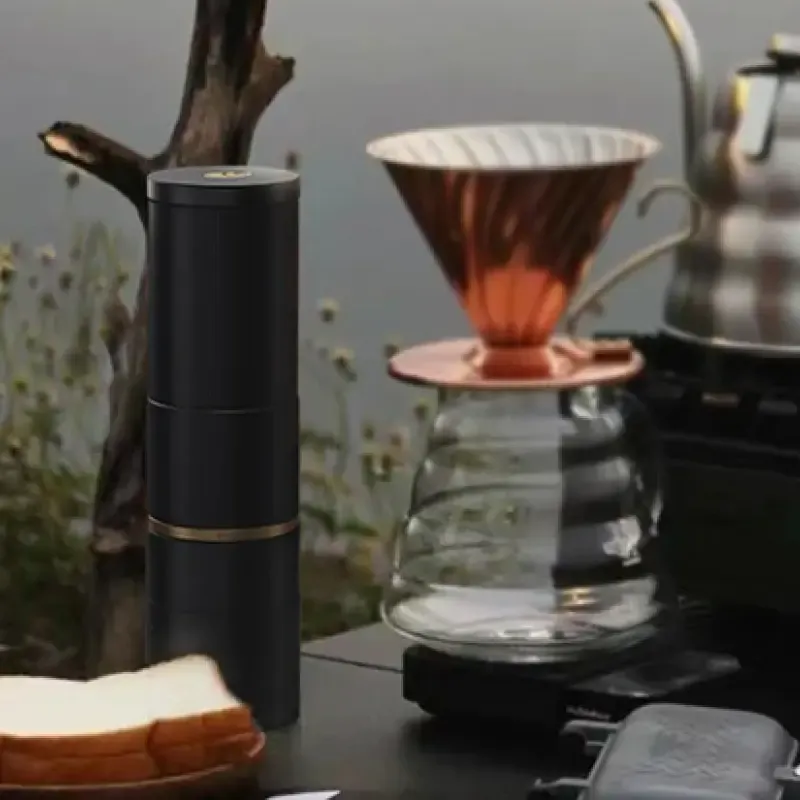 Cocinare essence Grinder on a table with a pour over carafe