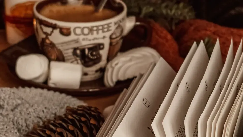 coffee cup, mashmallow and a book