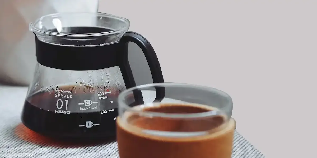 Brewing a cup of coffee in a pot