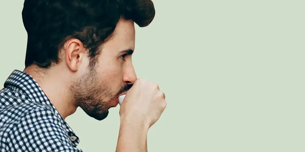 Millennial drinking a cup of coffee