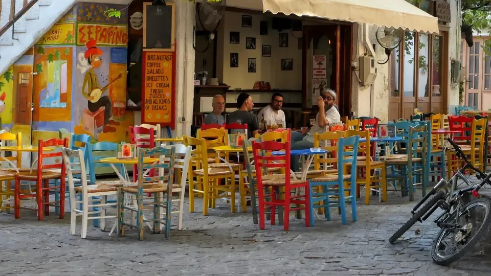 A color cafe in Greece with vibrant chairs