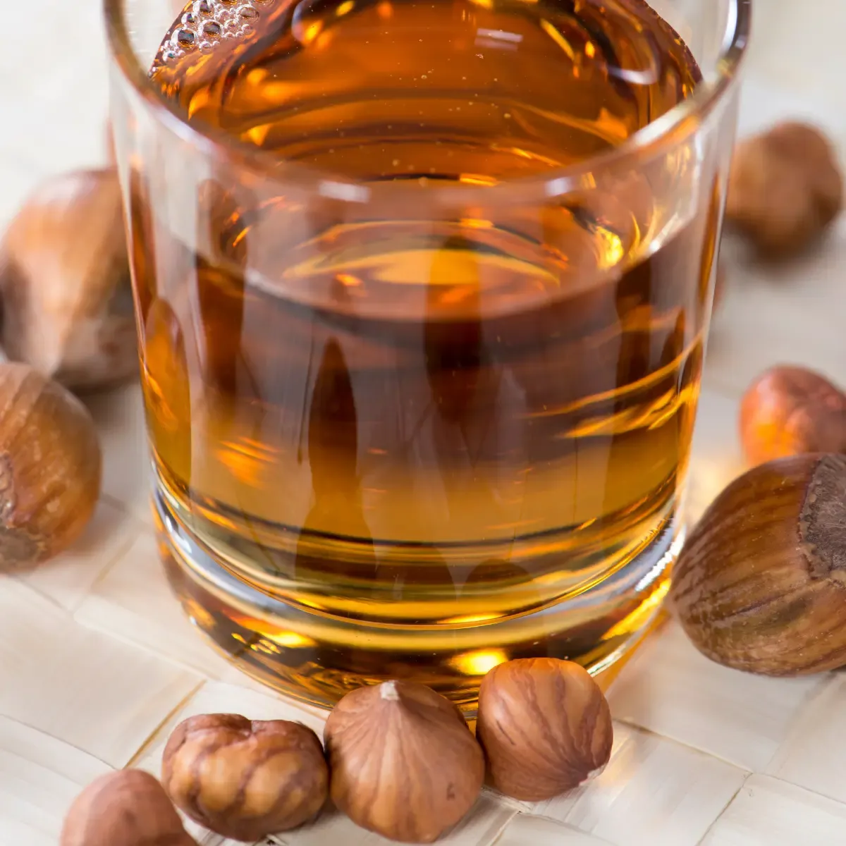 glass containing hazelnut syrups with hazelnuts