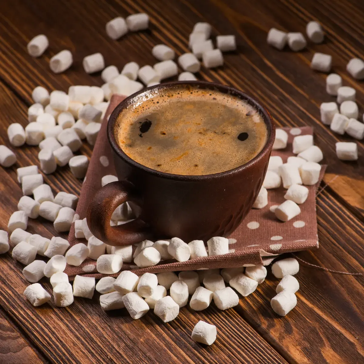 Marshmallows around a coffee cup