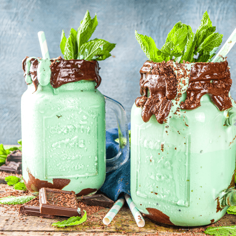 Two tall glasses of Mint Chocolate Frappé