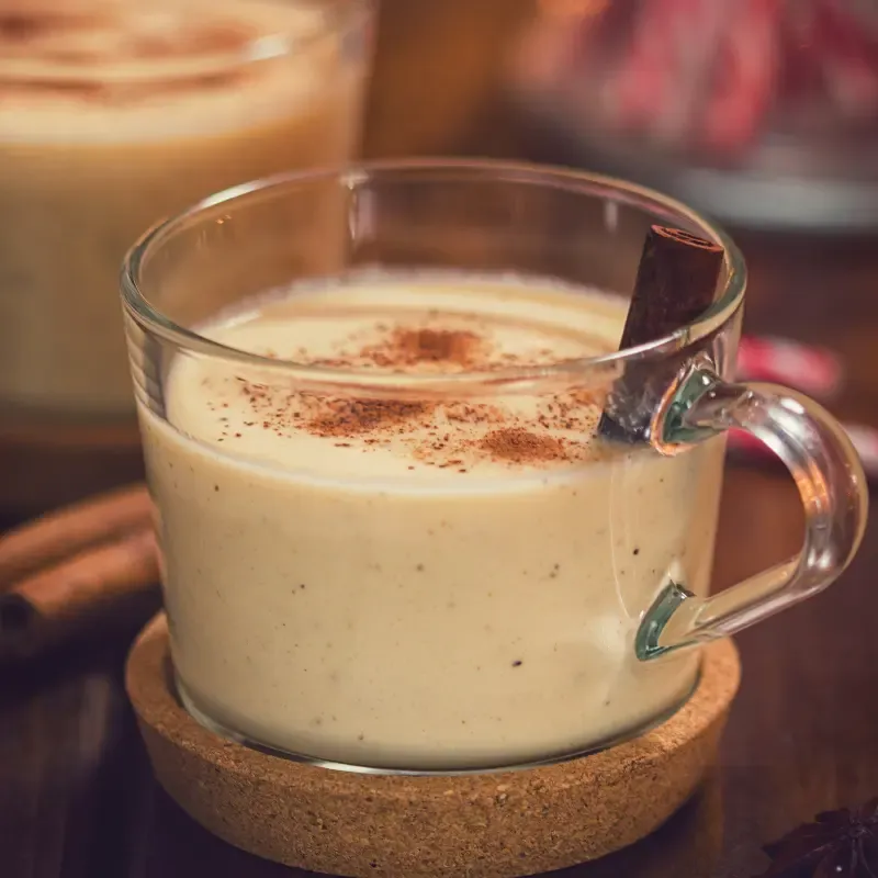 Eggnog latte in a glass cup