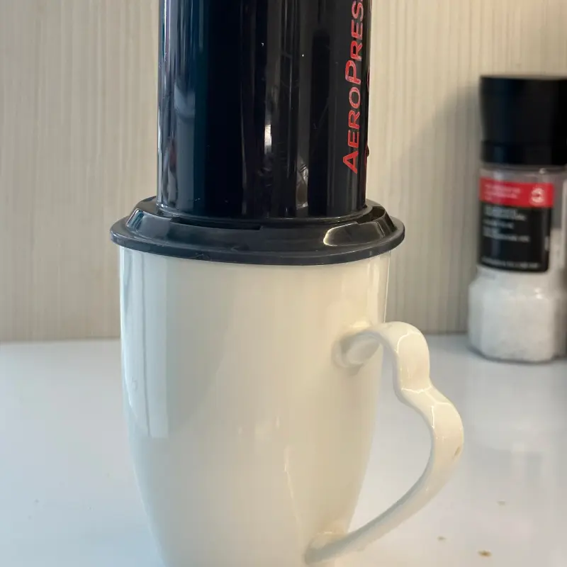 Aeropress after swirling on top of a coffee cup