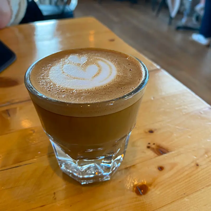 Piccolo in a glass on a table at Legends coffeeshops