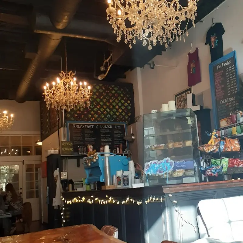 Loft Espresso in Manitou Springs - chandeliers on ceilings, barista making coffee