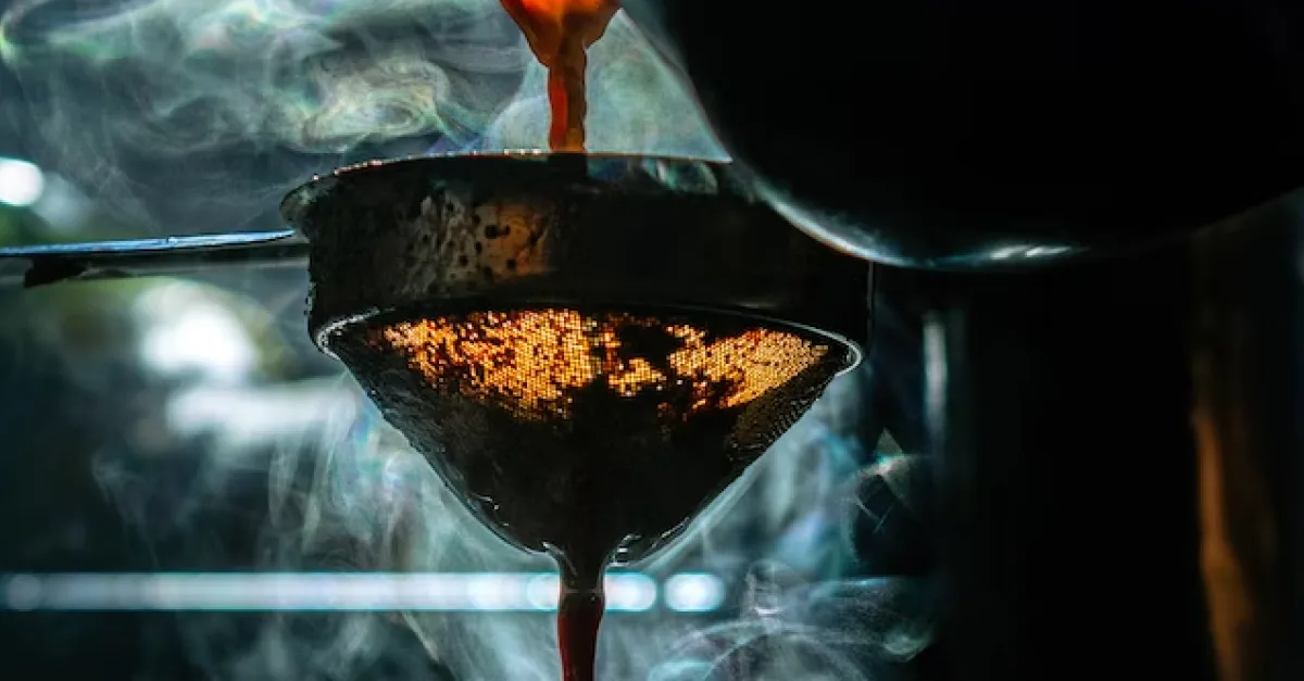 Pouring coffee through a filter