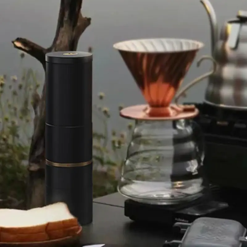 Cocinare essence Grinder on a table with a pour over carafe