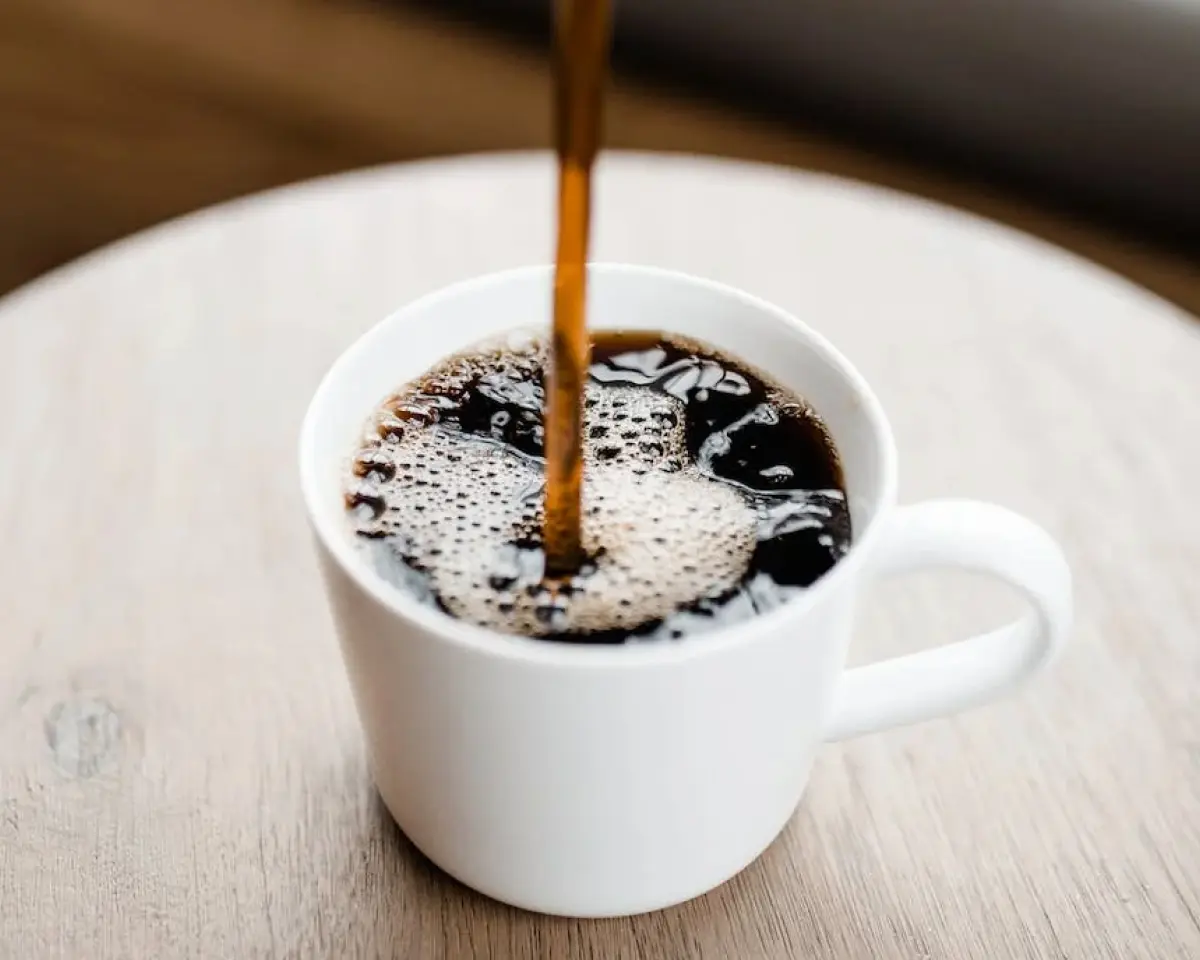 coffee being poured into a cup