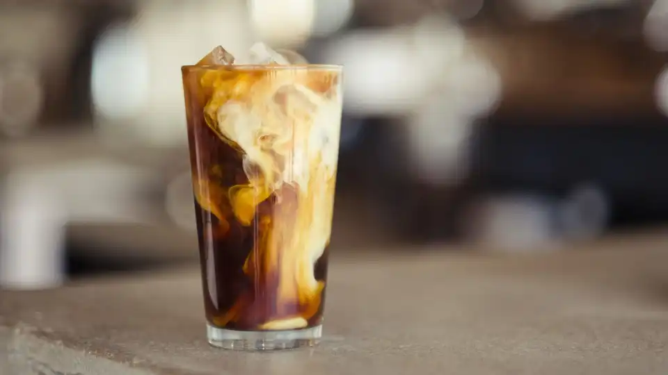 Glass of decaf coffee concentrate on a table