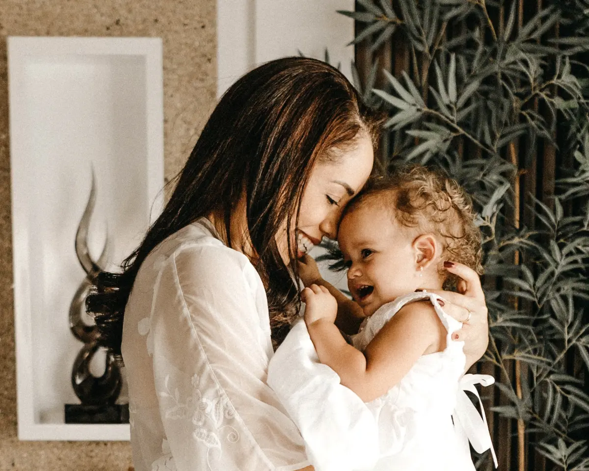 A mother hugging her baby