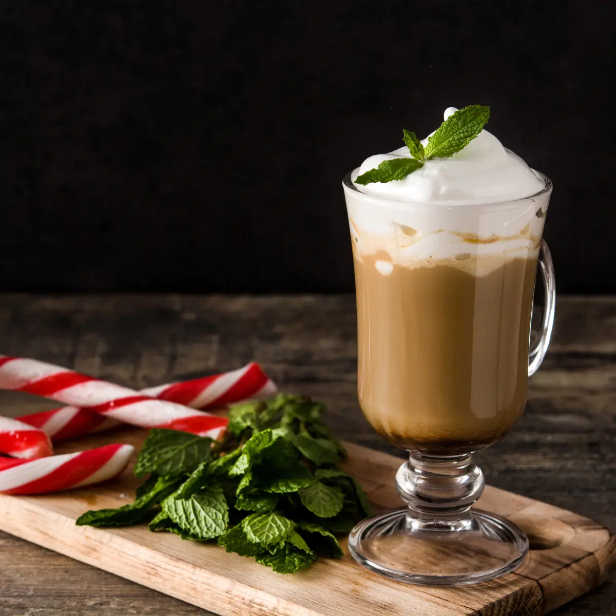 peppermint syrup coffeewith foam and peppermint leaves