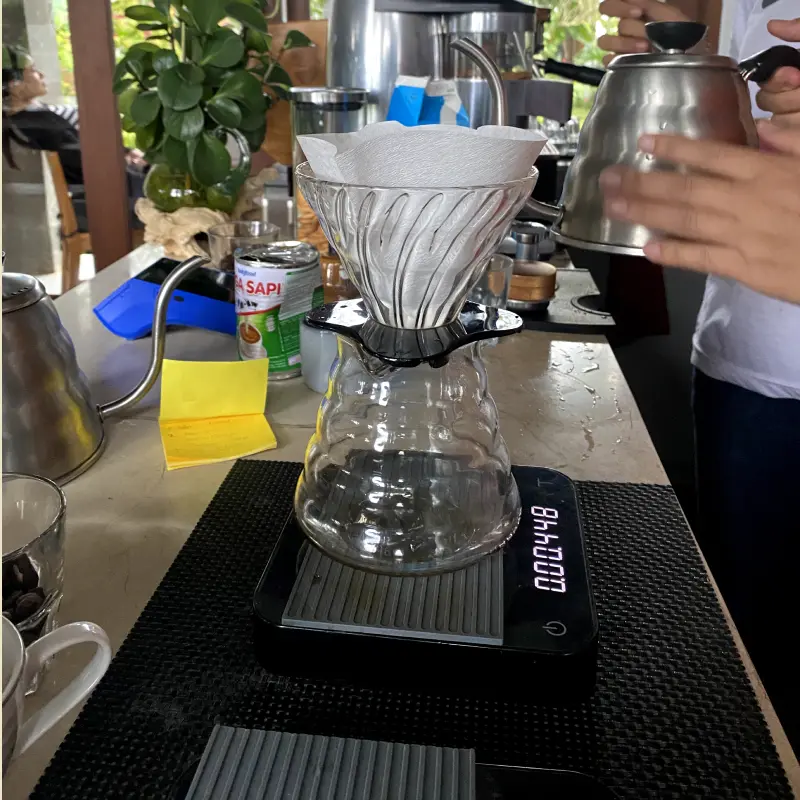 Pour over methos shown with a carafe and a pour over coffee maker