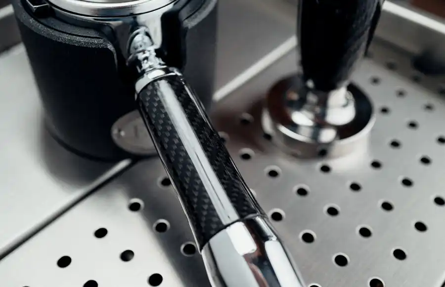 Carbon fiber portafilters on the Synchronika Espresso Machine